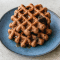 A plate of chocolate brownie waffles made with simple keto ingredients, perfect for Breakfast Ideas Gluten Free Healthy Recipes. Great for a Gluten Free On The Go Breakfast, low-carb eaters, or anyone looking for Sweet Chaffle Recipes Easy and Waffle Maker Recipes Healthy options.