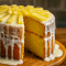 A golden Bundt-style Pineapple Cake Recipe Homemade topped with glossy Pineapple Icing, showcasing tropical inspiration from Pineapple Coconut Upside Down Cake, Pineapple Drizzle Cake, and Pineapple Upside Down Layer Cake. A light, moist crumb that works beautifully with Pineapple Cake Filling Recipes, easily adapted into a Pineapple Bundt Cake Easy or a rich Pineapple Pound Cake Homemade, finished with an extra drizzle of sweet Pineapple Cake Icing.