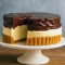 Homemade Boston Cream Pie Cake with layers of soft sponge, creamy custard, and glossy chocolate ganache – a decadent Pastry Cream Cake that’s perfect for celebrations.