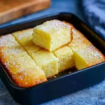 Golden, flaky French Butter Cake Recipe baked in a round pan, dusted lightly with powdered sugar — a classic from French Dessert Recipes and Butter Cake Recipe traditions, perfect for enjoying as a French Dessert, part of Baking Sweets, and one of the most loved Butter Cake styles celebrated by How Sweet Eats, for anyone ready to Eat Dessert and savor Decadent Desserts.