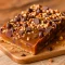 Delicious Caramel Chocolate Bars layered with Crispy Fudge, caramel, and chocolate, perfect as Chocolate Toffee Magic Layer Bars or Chocolate Cake Bars for dessert lovers.
