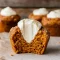 Close-up of moist Pumpkin Muffins With Maple Cream Cheese, topped with cinnamon sugar and filled with creamy maple cream cheese—perfect Thanksgiving Dishes Dessert idea. These bakery-style Pumpkin Cream Cheese Desserts look like Pumpkin Cream Cheese Crumble Muffins with a touch of sparkle, giving the cozy feel of Pumpkin Spice Muffins With Whipped Cream. Beautifully golden Pumpkin Muffins Filled With Cream Cheese and optional Nut-topped Pumpkin Muffins, ideal for seasonal Fall Baking Recipes and festive Pumpkin Recipes Dessert creations.