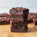 Close-up of fudgy Cheese Brownies with shiny tops and melty chips — a standout on Cottage Cheese Dessert Recipes lists, praised as Cottage Cheese Recipes Healthy and among the best Cottage Cheese Desserts; a creative Cheese Dessert that’s also one of the most Delicious Brownies, perfect for Protein Desserts, featured in Cottage Cheese Recipes and Healthy Sweets Recipes.