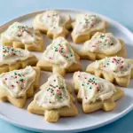 Soft Eggnog Cookies topped with creamy frosting and festive sprinkles, a perfect Unique Christmas Treats idea for the holidays.