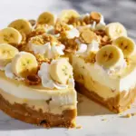 Close-up of a creamy Banana Cheesecake Pudding topped with banana slices and vanilla wafers, a dreamy twist on classic Banana Pudding Ideas and rich Desserts With Cheesecake Filling, perfect for cozy Comfort Dessert Recipes lovers.