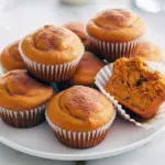Tray of golden Greek yogurt pumpkin muffins cooling on a rack — a perfect photo for Recipes Using One Cup Of Pumpkin, inspired by Fresh Pumpkin Recipes Healthy, serving as a light Pumpkin Yogurt Dessert and an example of Greek Yogurt Dessert Recipes Healthy; also pictured as Pumpkin Pie Muffins Healthy in my Greek Yogurt Pumpkin Recipes collection for Recipes With Pumpkin Puree Healthy, ideal for Healthy Pumpkin Baking and a cozy Fall Dessert Healthy.