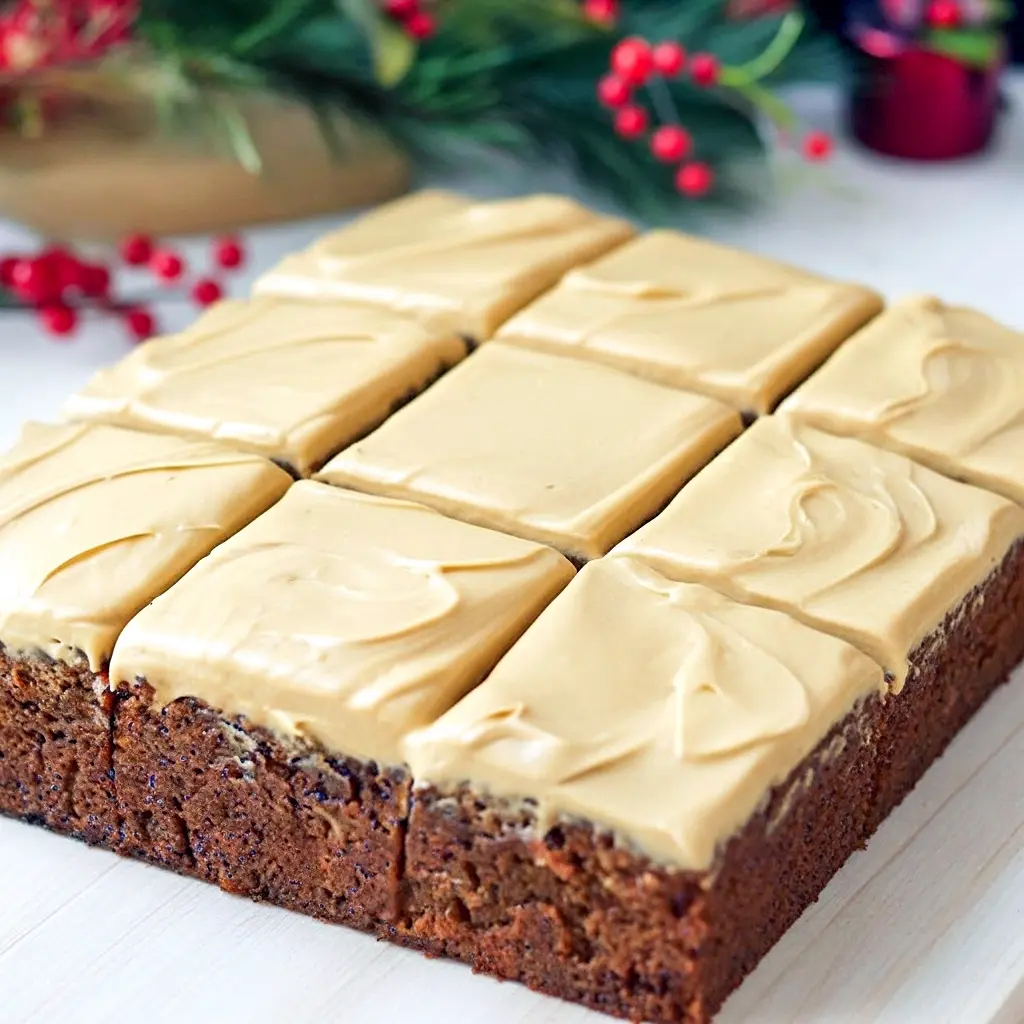 Slice of molasses-topped gingerbread with cream-cheese frosting — the ultimate Gingerbread Recipe for when you want to Eat Dessert and savor Sweets Treats, Gingerbread Cake.