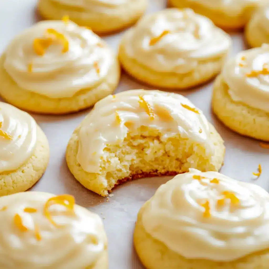 Close-up of glazed orange cookies on a wire rack, each topped with fine orange zest and a shiny citrus glaze, Orange Christmas Cookies Recipes.
