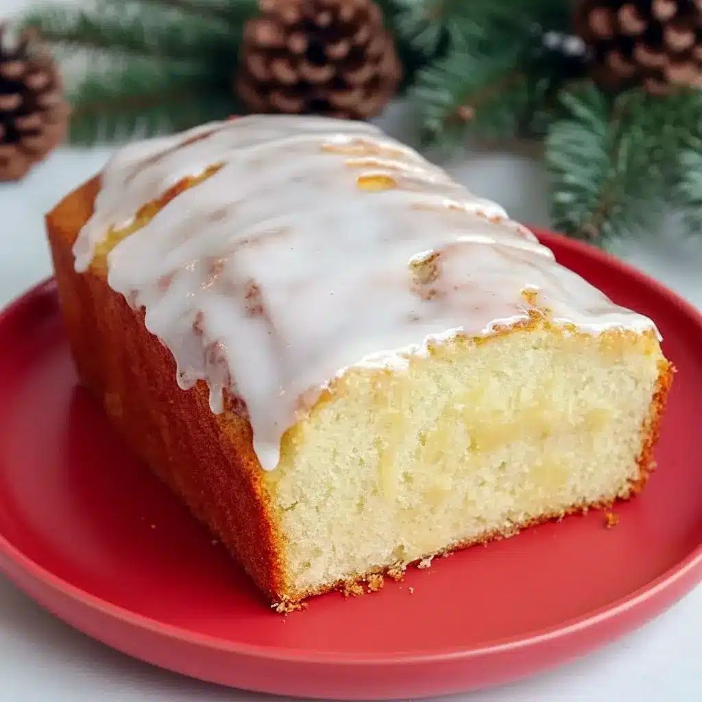 Close-up of a rum-glazed holiday loaf on a wire rack: a moist Eggnog Quick Bread that smells like Christmas Eggnog, ideal as an Eggnog Bread Recipe or adapted into an Eggnog Bread Recipe With Yeast for a chewier bite, Eggnog Bread With Rum Glaze.
