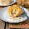 Easy Game Day Dinner Ideas: golden Buffalo Chicken Bombs on a platter, brushed with butter and served with blue cheese dressing and celery sticks.
