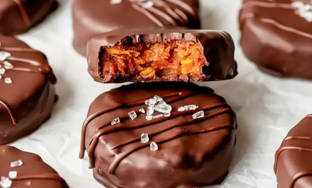 A stack of Chocolate Peanut Butter Cornflake Bites with glossy chocolate coating on a plate — a simple Cornflakes Recipe for busy snackers.