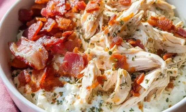 Chicken Bacon Ranch Cottage Cheese Bowl in a white bowl topped with shredded chicken, chopped bacon, and herbs — a cozy Macro-Friendly Dinner close-up.