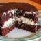 Sliced Ding Dong Cake showing moist chocolate layers and a fluffy cream filling — a classic Cakes With Filling look.