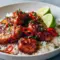 Glazed Thai Sweet Chili Chicken on rice, topped with sliced green onions and lime — an easy Thai Main Dish pressure-cooker dinner.