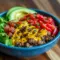For Low-Carb Meal Prep lovers: close-up of a cheeseburger bowl with seasoned Minced Meat, shredded cheese, pickles, cherry tomatoes and a drizzle of burger sauce — a hearty Protein Dinner option.