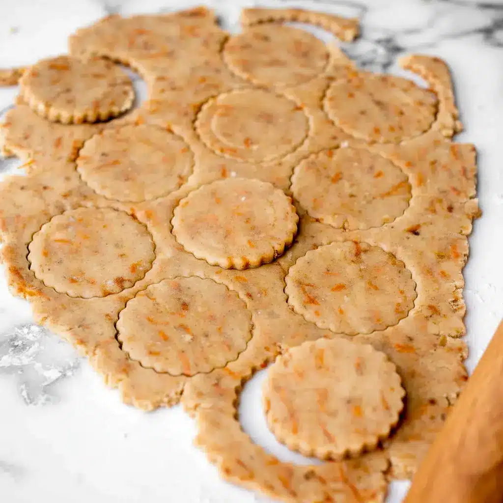 A plate of Carrot Cake Shortbread Cookies with a golden buttery texture, specks of carrot and walnut, and a light spring-inspired look for a cozy Carrot Cake Cookies pin.