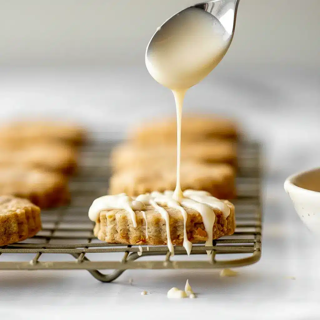 A plate of Carrot Cake Shortbread Cookies with a golden buttery texture, specks of carrot and walnut, and a light spring-inspired look for a cozy Carrot Cake Cookies pin.