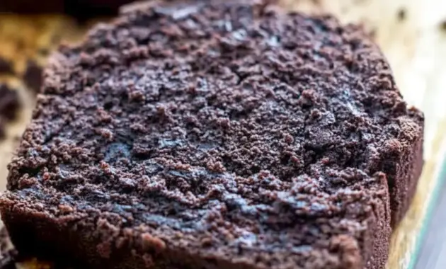 Dark Chocolate Mocha Breakfast Bread — sliced loaf with dark, tender crumb and melted chocolate chips, served on a wooden board.