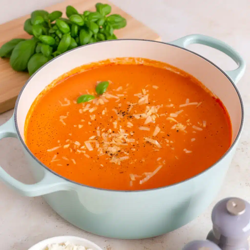 A pot of simmering High Protein Tomato Soup on the stove, perfect for Healthy Easy Soups and busy weeknight cooking.