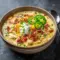 Creamy bowl of Jalapeño Popper Chicken Soup topped with bacon, cheddar, and green onions for Soup Recipes Family dinners.