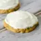 A plate of Zucchini Cookies topped with creamy frosting, styled as a soft homemade dessert inspired by Zucchini Cookies With Cream Cheese Frosting and Zucchini Recipes Cookies.