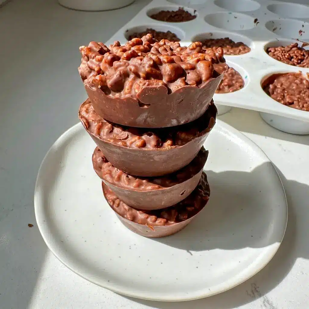 Chocolate Peanut Butter Crunch Cups with cereal mixed into the chocolate for simple Rice Crispy Peanut Butter Cups everyone will love.