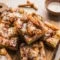 Cinnamon Roll Focaccia on a tray with a golden glaze, styled as one of the best Homemade Baked Snacks for brunch.