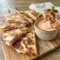 Corned Beef and Swiss Reuben Quesadillas served with creamy dipping sauce, perfect Sandwiches Sides for a cozy deli-style meal.