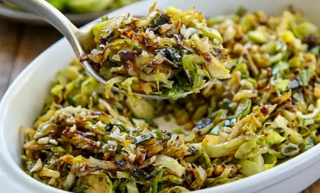 Shredded Brussels Sprouts skillet with parmesan and balsamic glaze, a simple Keto Shredded Brussels Sprouts side dish that feels crisp and rich.