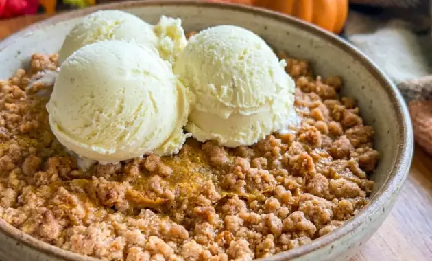 A warm Pumpkin Crisp topped with golden streusel, one of the best Things To Bake Thanksgiving for a cozy holiday dessert table.