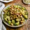Roasted Brussels Sprouts Caesar Salad served as a crisp Caesar Brussels Sprouts side with golden croutons and creamy dressing.