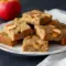 Apple Spice Bars – The Sweet, Comforting Dessert for Winter You Need1 A stack of soft, golden Apple Spice Bars filled with cinnamon apples, perfect Desserts For Winter and cozy Homemade Apple Blondies vibes.