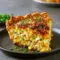 Cheddar Sweet Corn Pie — The Ultimate Corn Pie for Weeknights Golden-brown Corn Pie topped with melted cheddar, served warm as a comforting Savory Pie made with Sweet Corn, perfect for weeknight Veggie Dishes or Vegetable Sides.