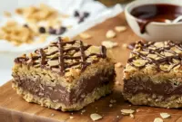 Chocolate Oatmeal Cookie Bars – Rich, Fudgy & Totally Addictive2 Close-up of chewy Chocolate Oatmeal Cookie Bars layered with peanut butter and melted chocolate, the perfect Dessert Using Oatmeal for quick and easy no-bake treats.