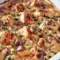 Creamy Baked Chicken Stroganoff — A Cozy Fall Favorites Recipes Dinner Golden-bubbly baked chicken stroganoff in a white casserole dish, creamy mushroom sauce coating egg noodles, garnished with chopped parsley.
