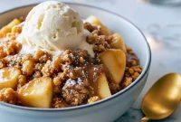 Golden, bubbling caramel apple dump cake in a slow cooker with a crisp top and gooey filling — a saucy Apple Pie Crockpot Recipe alternative that fits right into your Crock Pot Apple Dessert Recipes lineup and pairs perfectly with Easy Fall Sides.