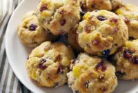 Loaded Breakfast Biscuits - Make Ahead Camping Food Breakfast Golden Breakfast Biscuits filled with eggs, bacon, and cheese on a rustic campfire table — the perfect Make Ahead Camping Food Breakfast for easy Campfire Cooking Breakfast outdoors.