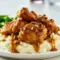 Maple Bourbon Pecan Chicken — Skillet Dinner Recipes in 30 Mins Close-up of glossy maple-bourbon chicken thighs on mashed potatoes, sauce pooling around the edges with chopped nuts visible — a Gluten Free Recipes For Dinner style plate with Iowa Girl Eats energy and a hint of Pollo Loco flair.