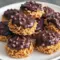 Must-Try Christmas Baking Idea Chocolate Peanut Butter Haystacks Close-up of chocolate peanut butter haystacks on parchment — perfect for Christmas Baking and a festive Dessert Platter, a crowd-pleasing Candy Recipes Homemade choice that ends any Snack Attack; think classic Cookies Recette vibes with Butterscotch Chips and crunchy Chocolate Peanuts for an irresistible Sweet And Salty finish — an easy addition to Easy Snack Recipes collections.