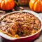 Rustic Pumpkin Pecan Cobbler — Cozy Thanksgiving Recipes Pumpkin Idea A rustic homemade Pumpkin Pecan Cobbler in a white baking dish topped with caramel sauce and toasted pecans, the ultimate cozy Pumpkin Desserts Thanksgiving recipe idea inspired by Thanksgiving Recipes Pumpkin and Pumpkin Crumble Pie flavors.