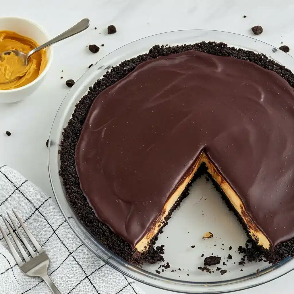 Skrewball Pie — Salted Chocolate Peanut Butter Pie with a Boozy Twist Slice of Skrewball pie with Oreo crust, whipped peanut butter filling and shiny chocolate ganache, garnished with chopped peanuts and flaky salt.