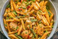 Addictively Spicy Chicken Chipotle Pasta Cheesecake Factory Inspired Favorite1 Close-up of a creamy, spicy plate of pasta inspired by Chipotle Pasta Recipes, featuring bold flavors reminiscent of Chicken Chipotle Pasta Cheesecake Factory and the unforgettable kick of Cheesecake Factory Spicy Pasta, showcasing vibrant veggies like Chicken Pasta With Bell Peppers for a restaurant-style finish.