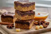 A close-up of fudgy gingerbread brownies swirled with chewy cookie layers — a cozy Holiday Baking treat that’s perfect for Christmas Desserts and festive Brownie Recipes fans.