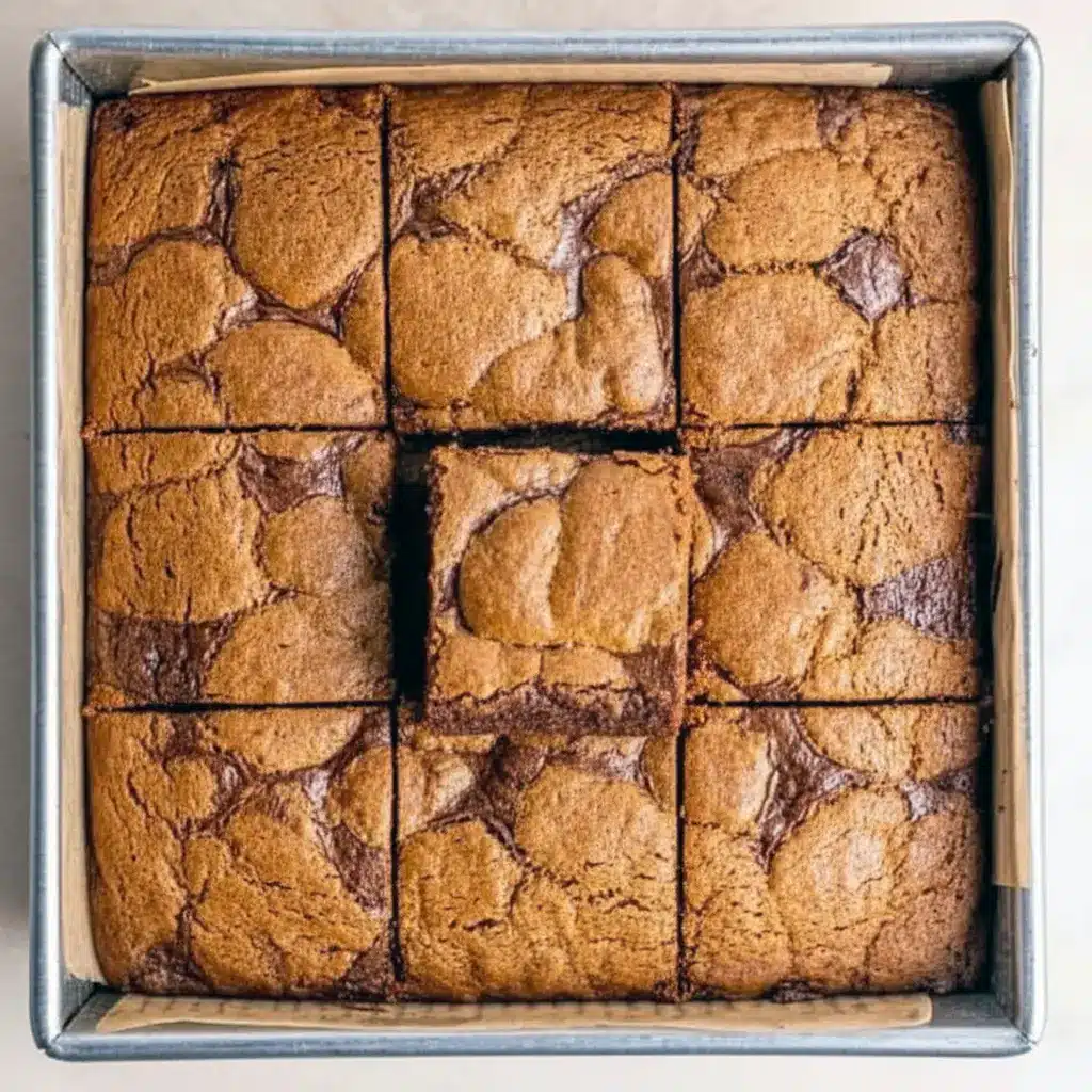 A close-up of fudgy gingerbread brownies swirled with chewy cookie layers — a cozy Holiday Baking treat that’s perfect for Christmas Desserts and festive Brownie Recipes fans.