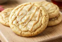 Chewy Maple Brown Sugar Cookies – Soft, Buttery & Bursting With Fall Flavor2 Close-up of Chewy Maple Brown Sugar Cookies topped with maple glaze on a rustic plate, showcasing golden edges and a soft, chewy texture perfect for Maple Desserts and fall baking.