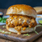 Easy homemade Cajun chicken sloppy joes piled onto toasted buns with peppers, onions, and bold Cajun seasoning, creating a saucy and flavorful Southern-style sandwich.
