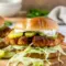 Close-up of a golden Crispy Dill Pickle Chicken Sandwich styled like a Grilled Chicken Sandwich With Pickles, paired with a Grilled Chicken Sandwich With Chips and infused with zesty notes from Chicken Sandwich Pickle Juice.