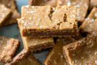Ginger Molasses Cookie Bars – Chewy, Spiced & Perfect for Holiday Baking!1 A pan of chewy Ginger Molasses Cookie Bars topped with sparkling sugar, the perfect Molasses Bar treat for cozy Holiday Bars Recipes baking days.