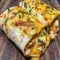 Cheesy garlic chicken wraps cooked until golden and melty, folded and sliced for a Quick Delicious Dinner, shown as an easy option for Chicken Wrap Recipes, Fast Dinner Recipes, and other Fun Easy Recipes.