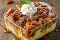 Irresistible Pecan Bourbon Bread Pudding with Sauce – Ultimate Fall Comfort Dessert4 Warm, gooey bread pudding infused with bourbon and pecans, drizzled in rich sauce and served fresh from the oven for the ultimate comforting dessert moment.